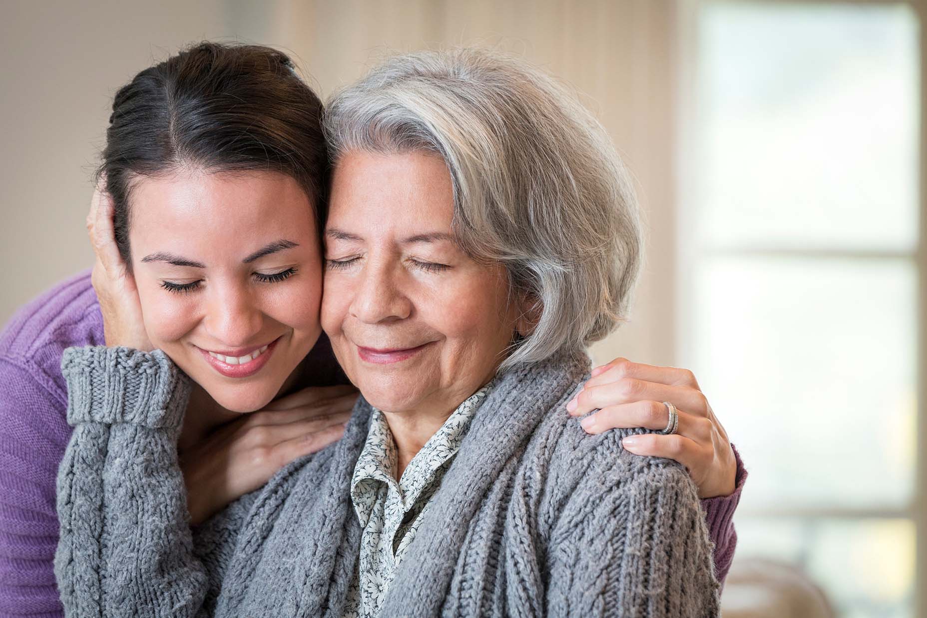 elderly-and-young-woman-embracing