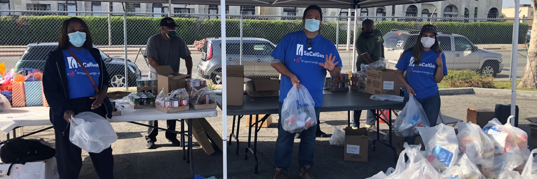 SoCalGas volunteers handing out food at a tent