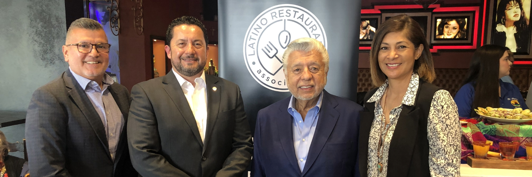 Member of Dine Latino Week posting for a photo with Andy Carrasco from socalgas