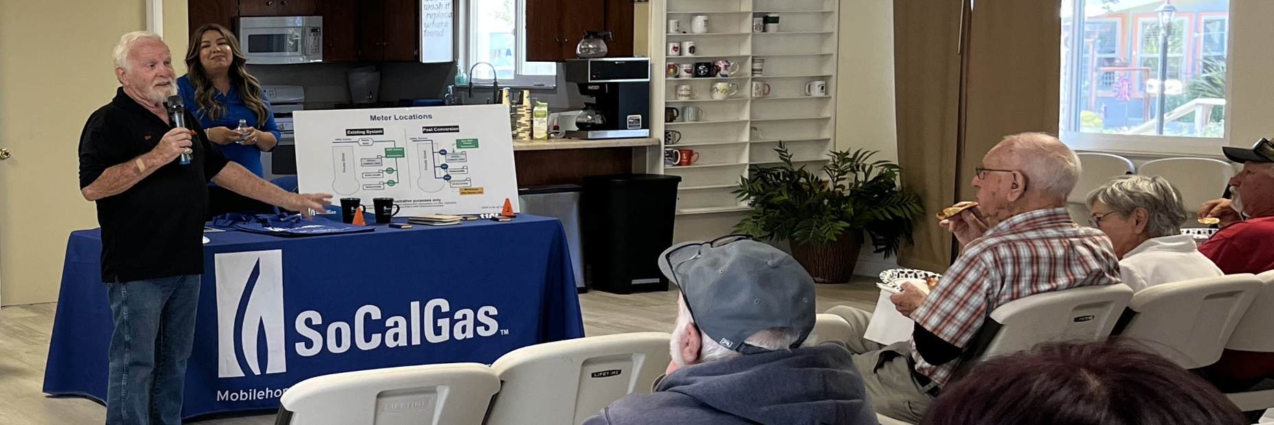 People talking at a community meeting