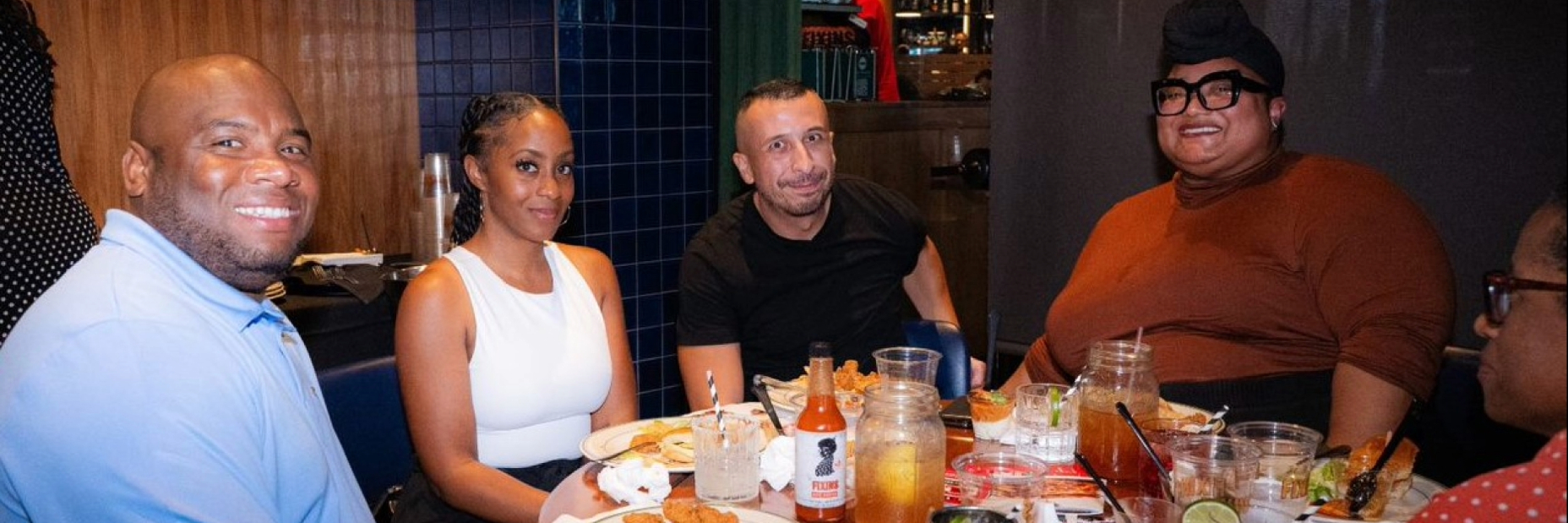 People sitting down for a meal at a restaurant