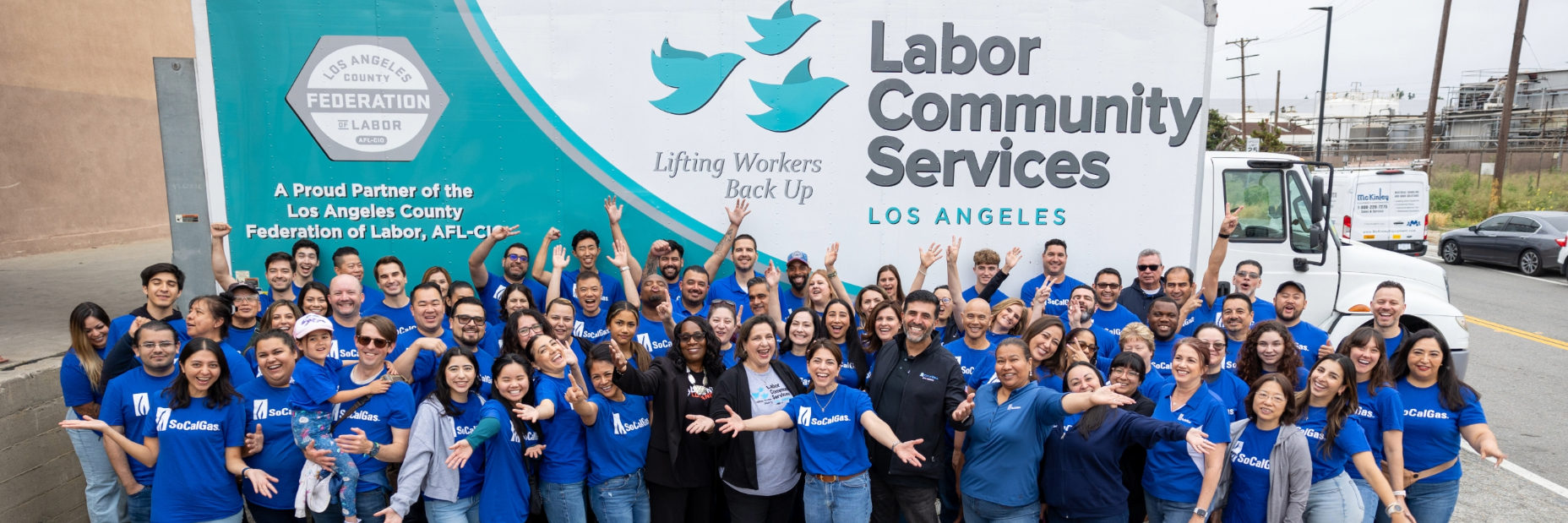 SoCalGas Volunteers posing in front of a Labor Community Services truck