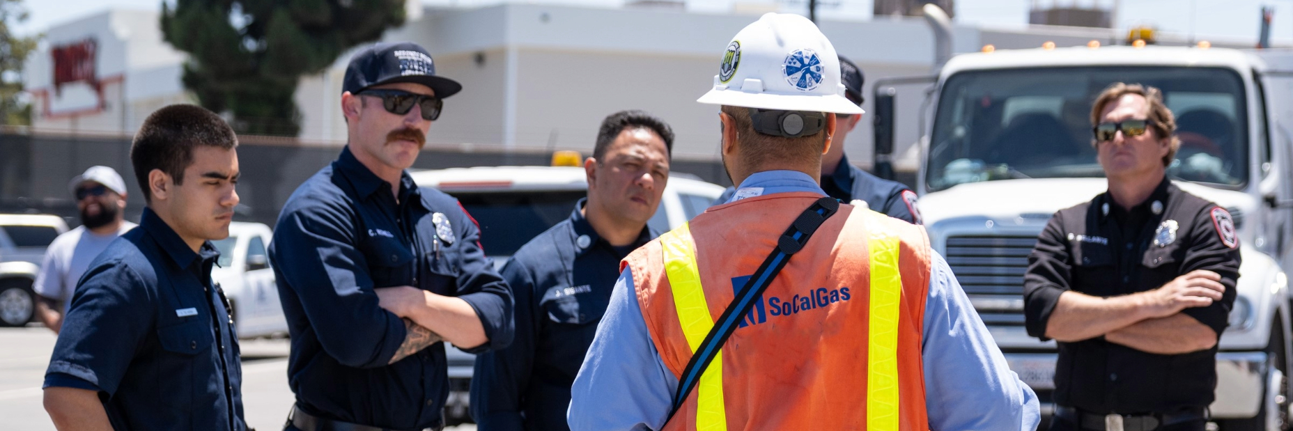 SoCalGas employee walking firefighters through an exercise about responding to the scene
