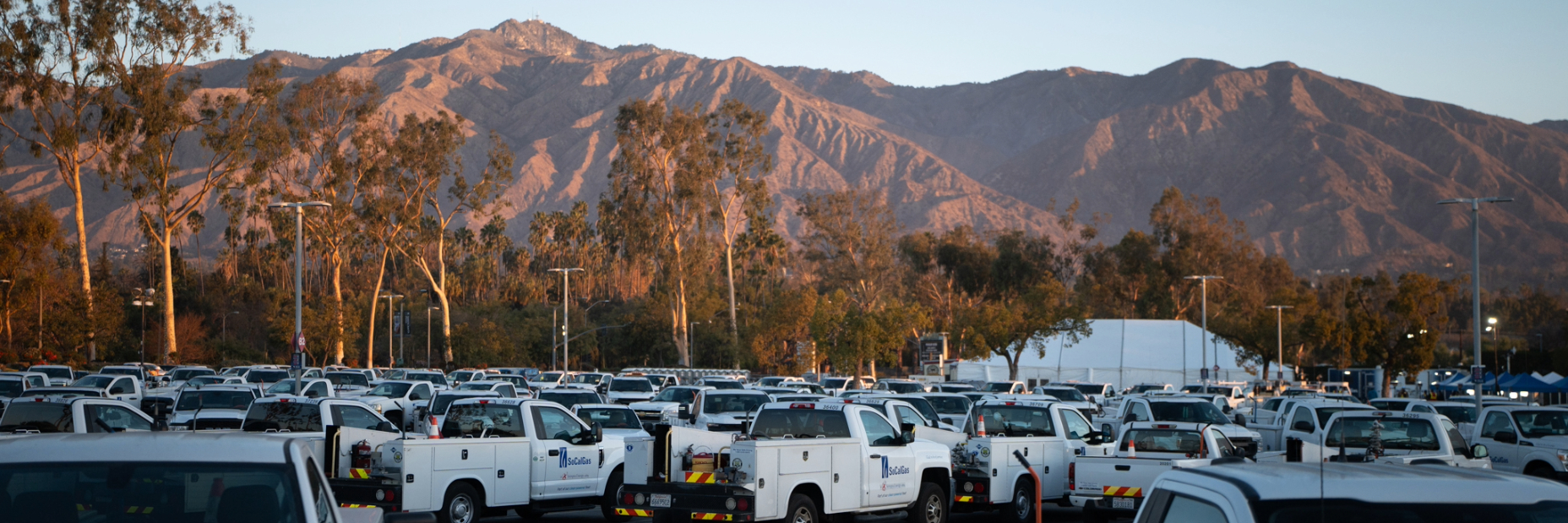 socalgas vehicles in a parking lot responding to the eaton fire