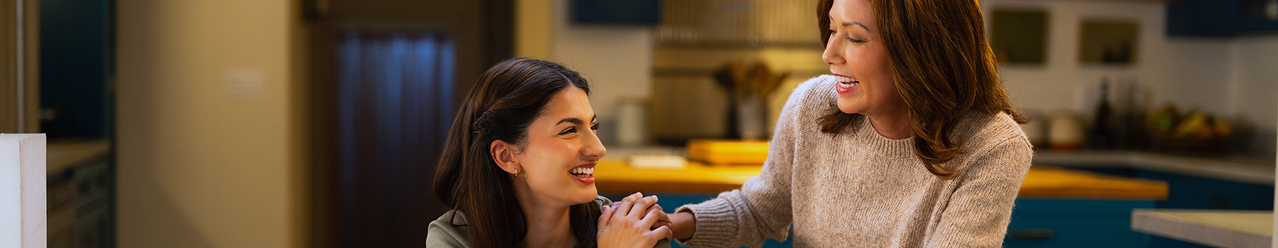 Mother placing her right hand on her daughter to offer support