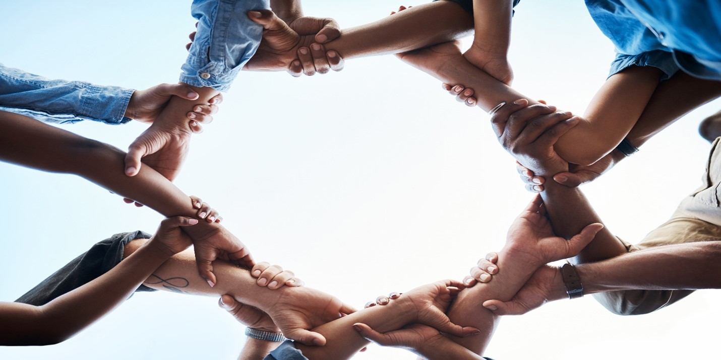 circle of hands holding