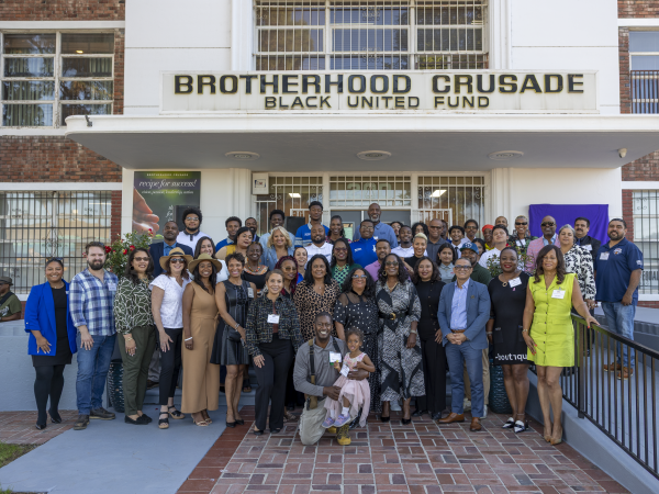 A goat eating dry grasses