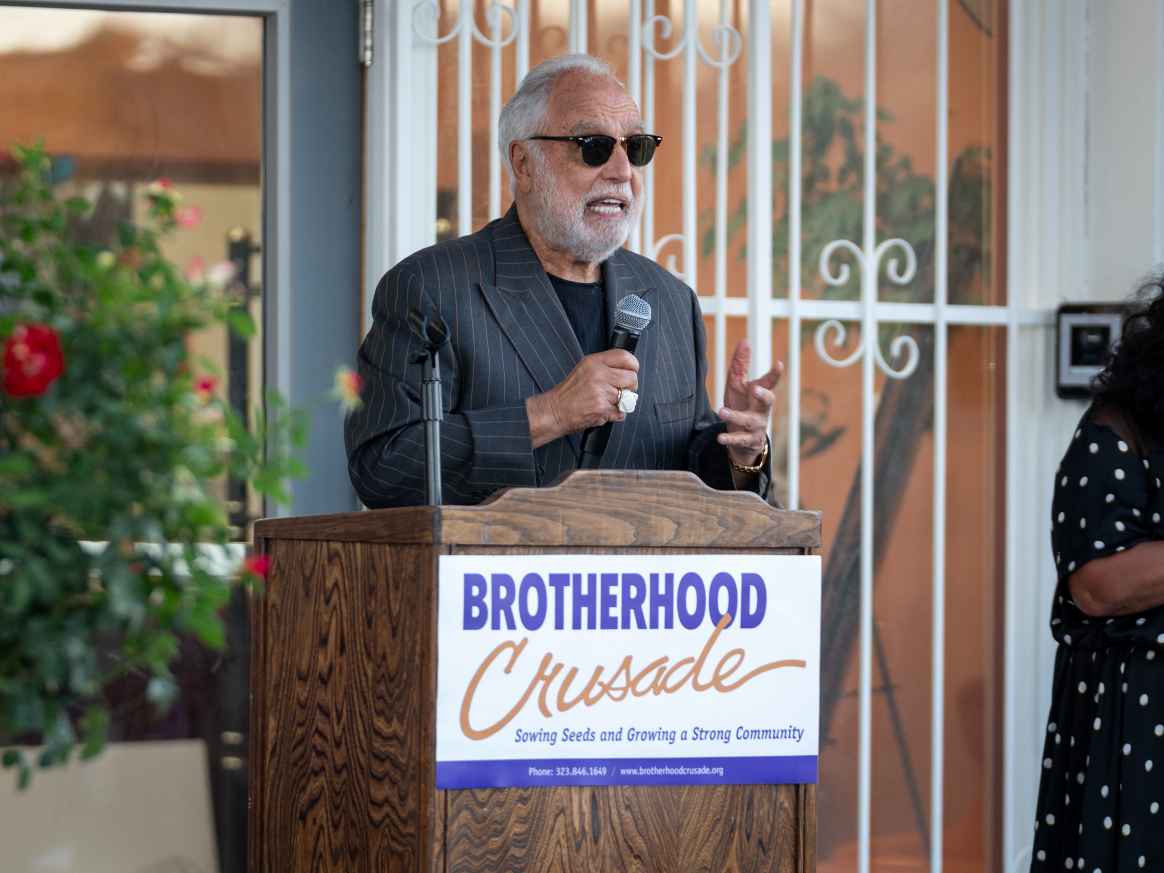 Man speaking behind podium