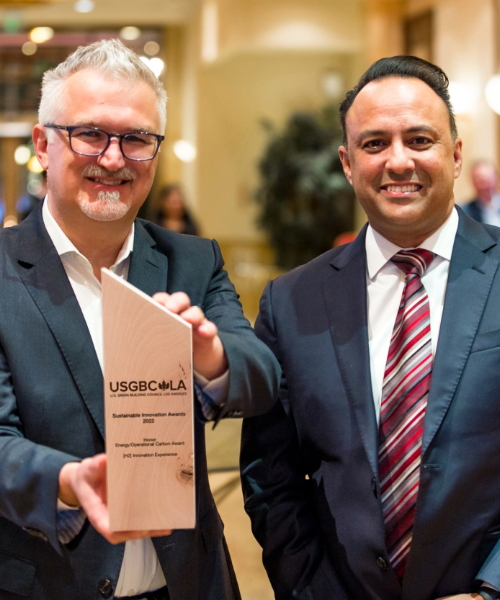 Neil Navin and Jawaad Malik holding the award