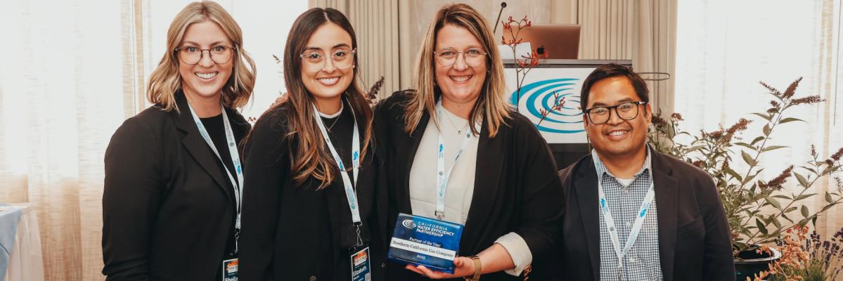 SoCalGas Team members holding award with Tia Fleming from CalWEP
