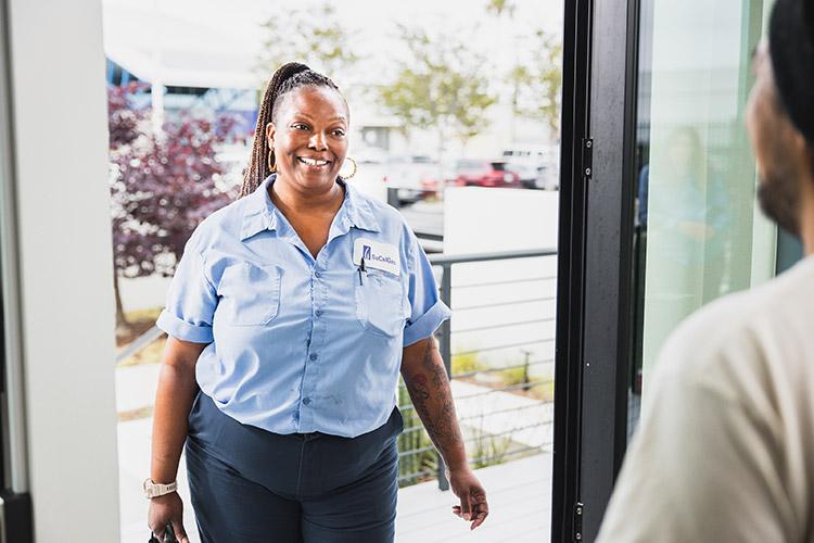 SoCalGas female employee at front door