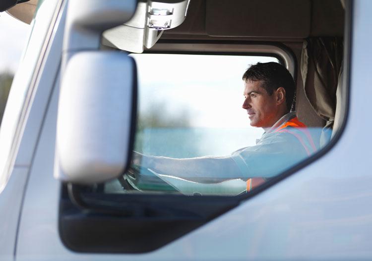 man-safety-vest-driving-truck