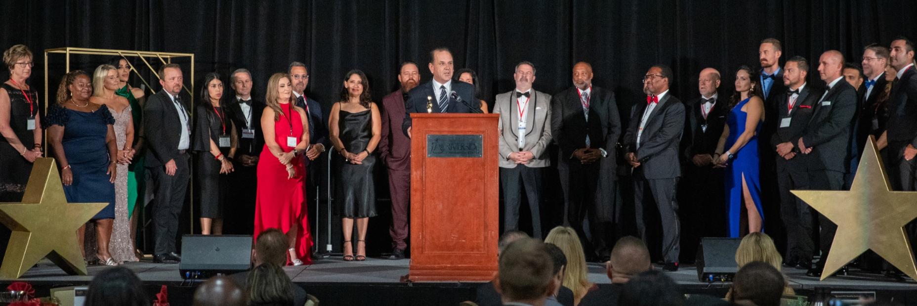 Scott Drury accepting an award at an event