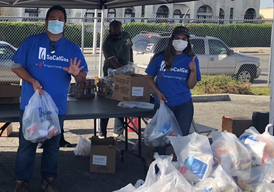 SoCalGas volunteers handing out food at a tent