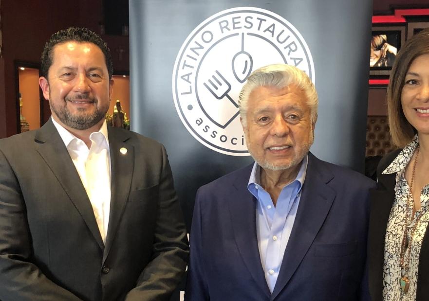 Member of Dine Latino Week posting for a photo with Andy Carrasco from socalgas