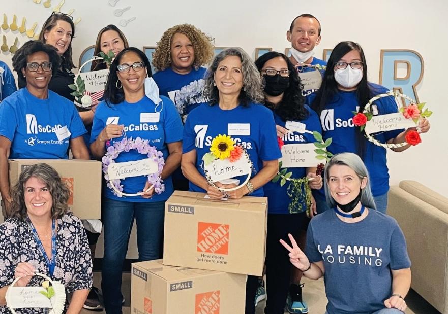 A group of socalgas volunteers posing for a picture at the event
