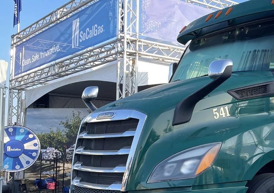 Semi truck that runs on renewable natural gas in front of the socalgas booth at the world ag expo