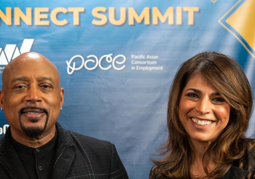 Maryam Brown, Daymond John and DOE representative pose for picture.