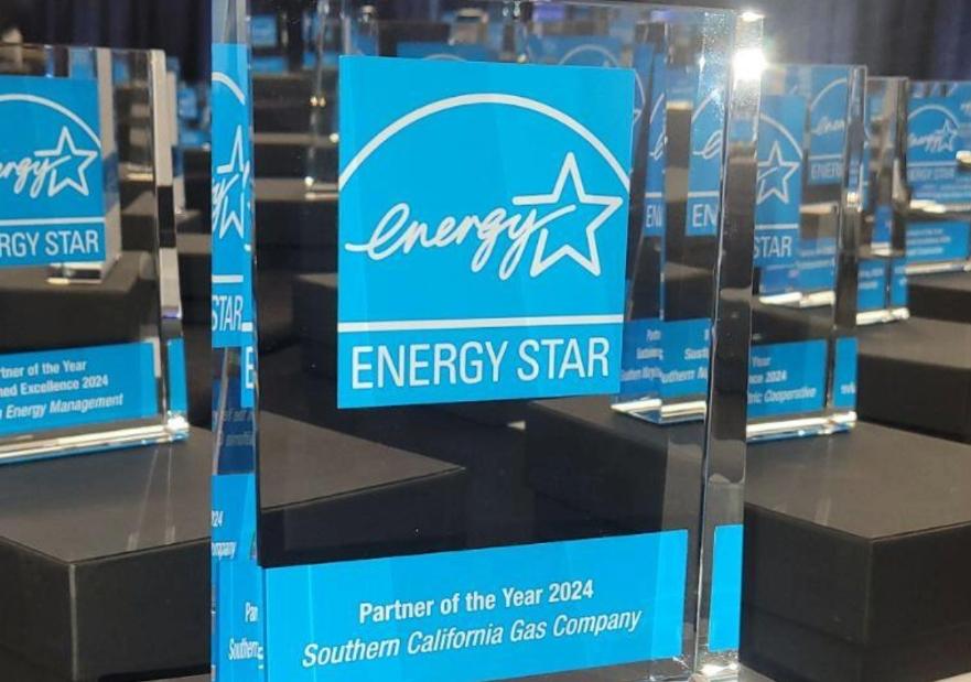 Image of the energy star award on a table with dozens of other awards