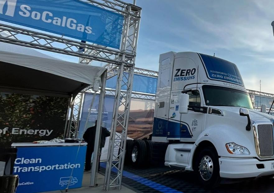 Hydrogen Fuel Cell Truck next to a 30 ft shovel at a SoCalGas exhibit booth