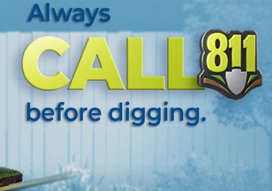 Lady on the phone holding a shovel calling 811 before digging