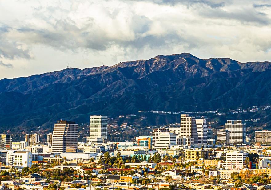 Generic image of city with mountains in the background