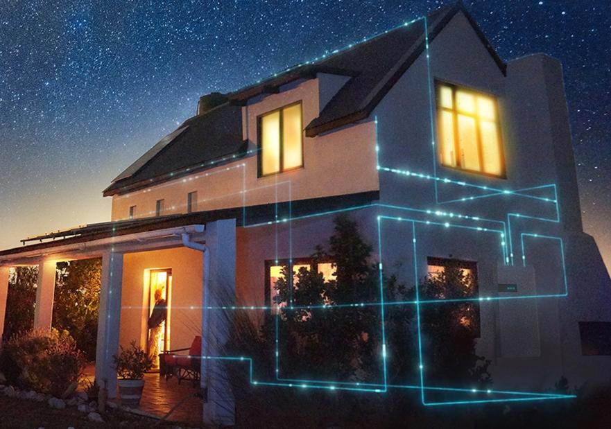 Image of blue laser pipes running through a house at dusk