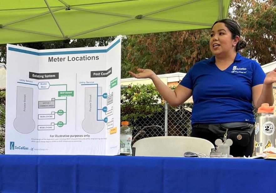 Information booth with employees standing at the ready to assist customers
