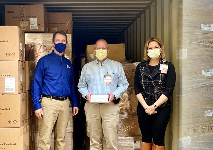 Pallets full of boxes of masks being delivered