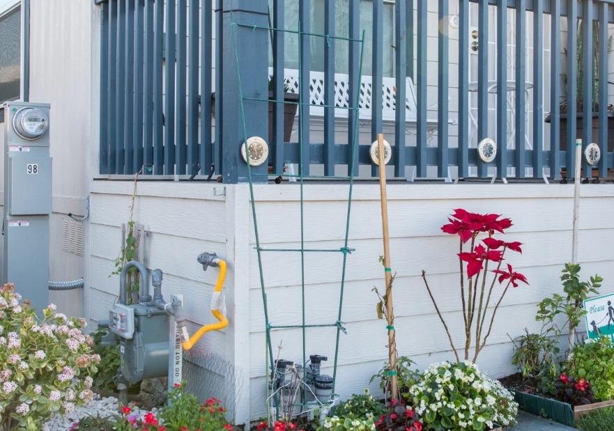 A gas meter on the side of a home
