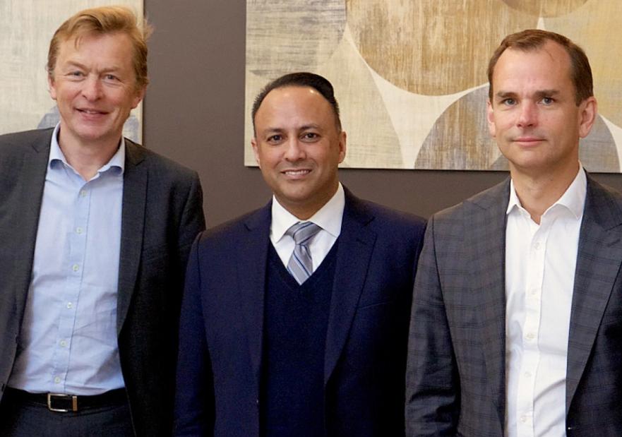 4 executives posing for a picture