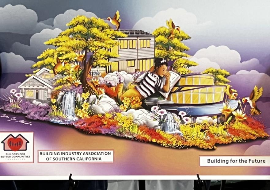 Two young students in front of float design drawing