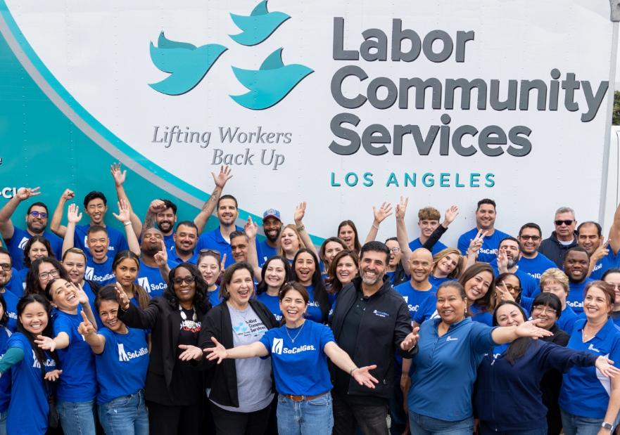 SoCalGas Volunteers posing in front of a Labor Community Services truck