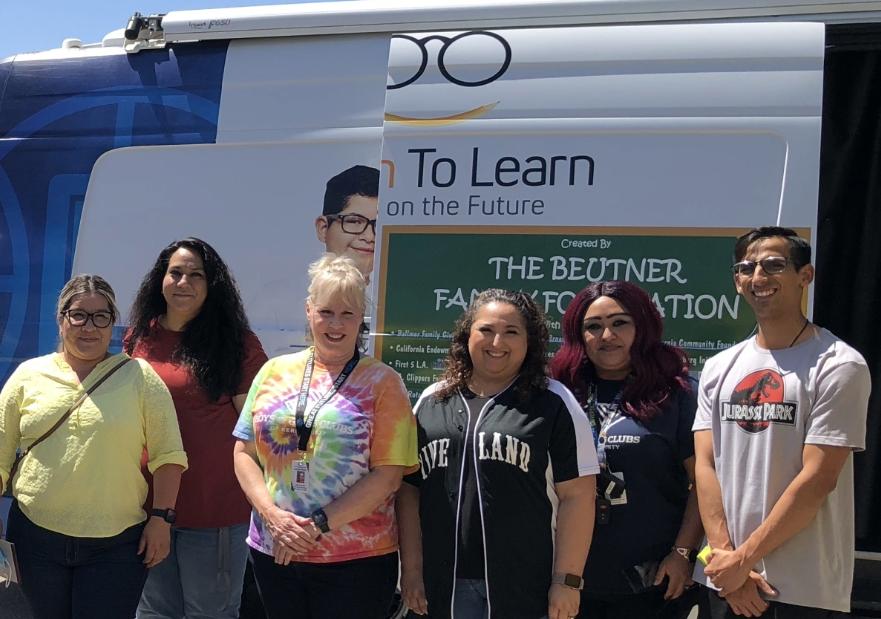 People from Vision to Learn standing in front of a socalgas pop up tent