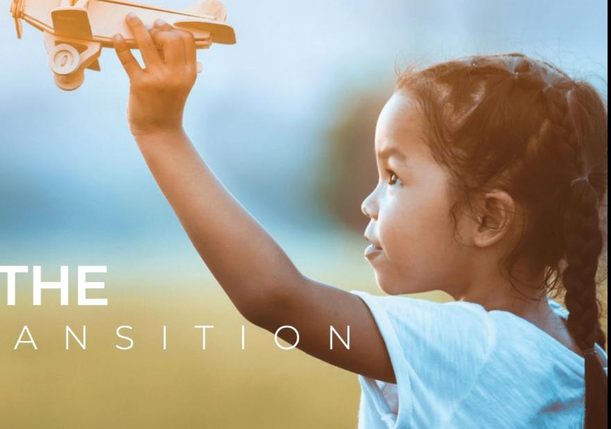 Little girl playing with wooden handheld plane with the text "leadership in the energy transition" in the foreground
