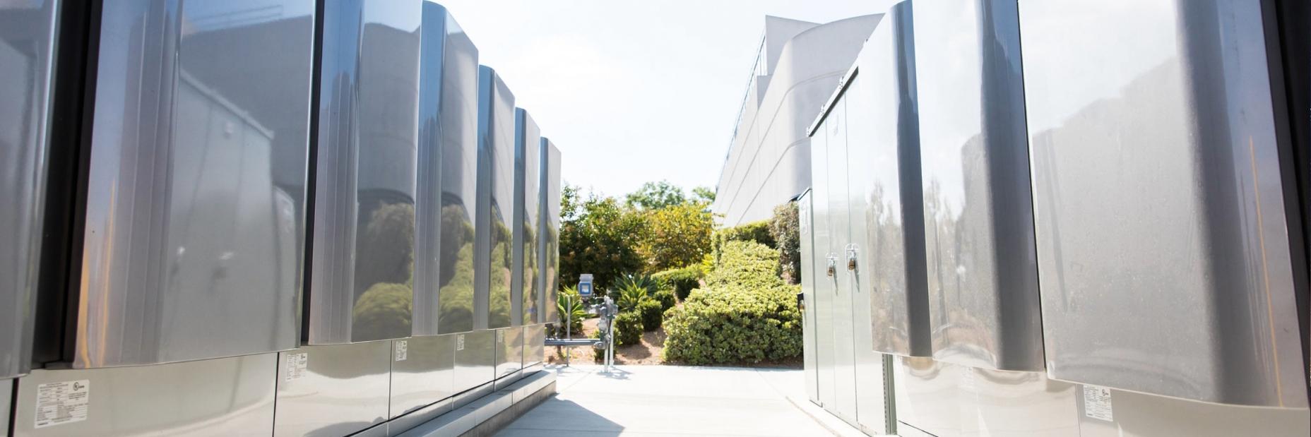 A row of fuel cells outside of a building