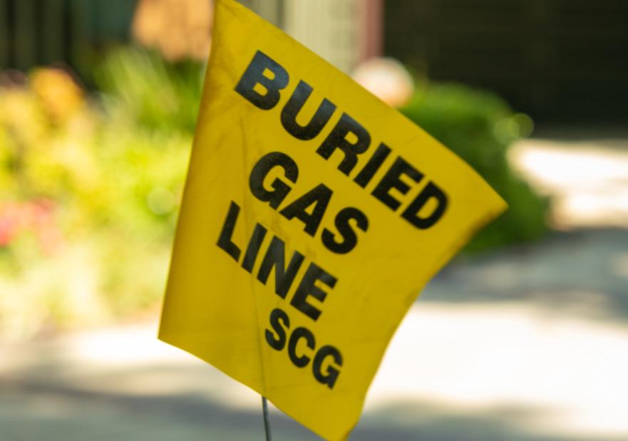 811 Day Images of Tech marking buried gas lines