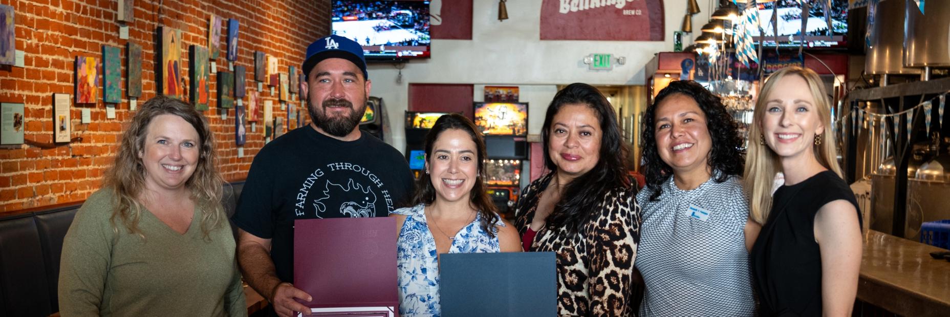 Group of people inside of a restaurant